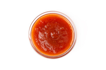 Bowl of tomato sauce, isolated on white background. Top view.