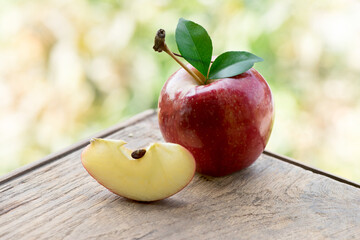 Red apple fruit on nature background.