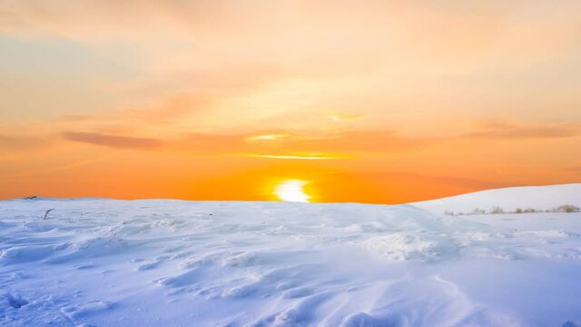 cnowbound plain at the red dramatic sunset time lapse scene