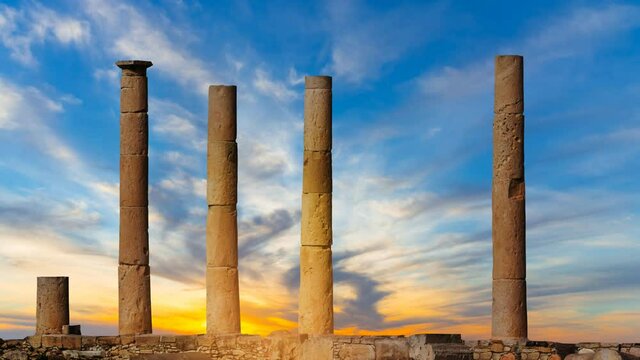 old ancient ruin on dramatic sunset background, mediterranean museum time lapse scene