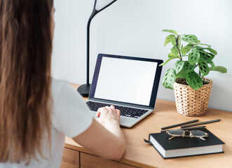 Young girl working at home office
