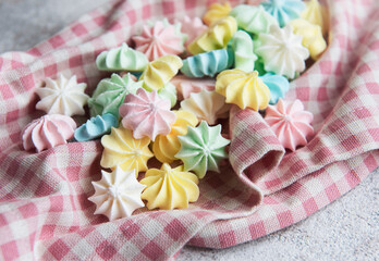 Fototapeta na wymiar Close-up delicious meringue cookies pastel colors