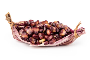 Red maize or corn fruits and seeds isolated on white background.