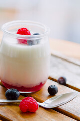 yogurt with raspberries in glass jars