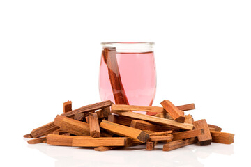 Sappan or caesalpinia sappan, wood and water isolated on white background.