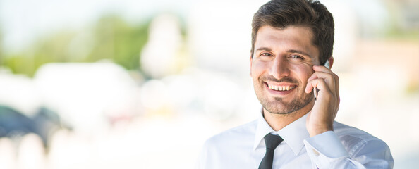 The handsome businessman phone