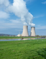 Nuclear power plant against sky and river