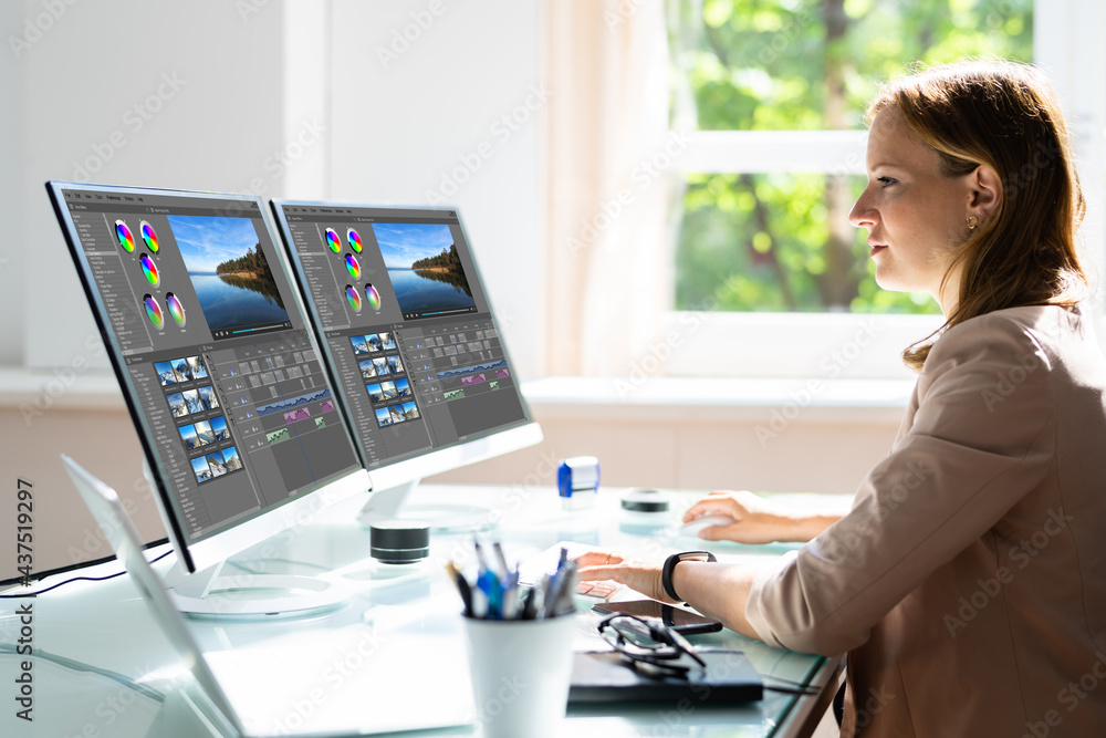 Aufkleber young female editor editing video on computer