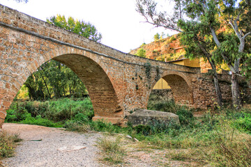 Fototapeta na wymiar Old Stone Bridge over Tuejar River