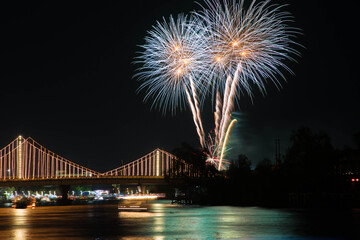 SURATTHANI, THAILAND - OCTOBER 17 : Beautiful firework display for celebration on the Tapee river on parades in Chak Phra Festival on October 17, 2015 in Suratthani, Thailand.