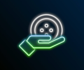 Glowing neon line Sewing button for clothes icon isolated on black background. Clothing button. Colorful outline concept. Vector