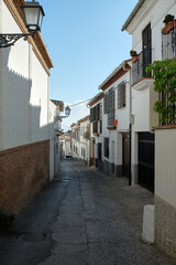 Fototapeta na wymiar white houses street, granada, andalusia