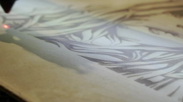 The laser engraving machine in action.