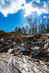 Construction waste dump. Environmental pollution from construction waste. Negative impact on nature.
