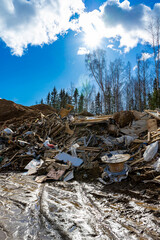 Construction waste dump. Environmental pollution from construction waste. Negative impact on nature.
