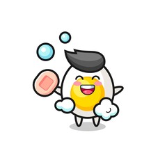 boiled egg character is bathing while holding soap