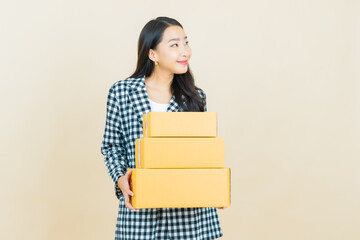 Portrait beautiful young asian woman with box ready for shipping