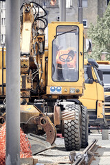 Heavy construction machines outdoors for public place reconstruction.