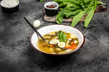 Sorrel soup with egg in bowl. Food recipe background. Close up, top view