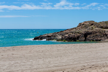 Fototapeta na wymiar End of Bolnuevo beach, Murcia, Spain. with fine sand, rocky area and turquoise waters
