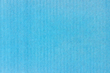 A sheet of blue colored paper. Rough smooth texture.