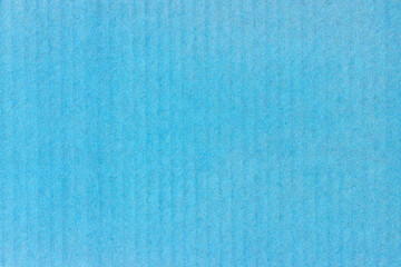 Obraz premium A sheet of blue colored paper. Rough smooth texture.
