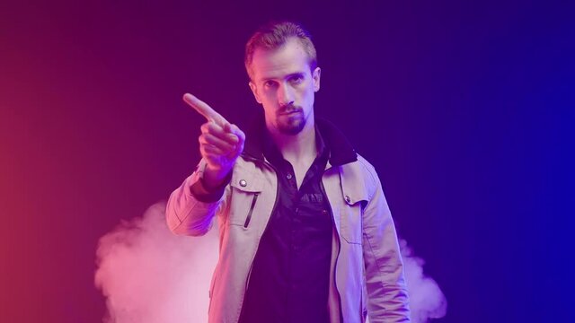 Confident man disagree with your decision waving with finger smoke blast in back