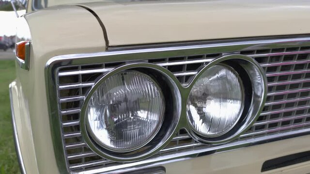 Old car headlights closeup camera movement slow motion
