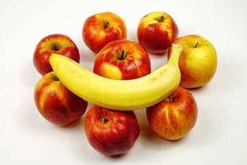 Fototapeta na wymiar Ripe red-yellow apples and banana lie on a white table
