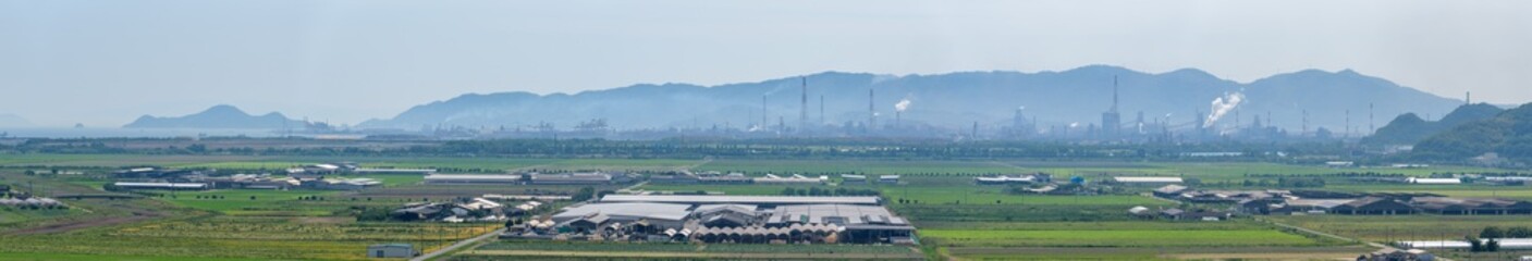 Obraz premium Panorama view of reclaimed land and industrial area (Kasaoka City, Okayama Prefecture)