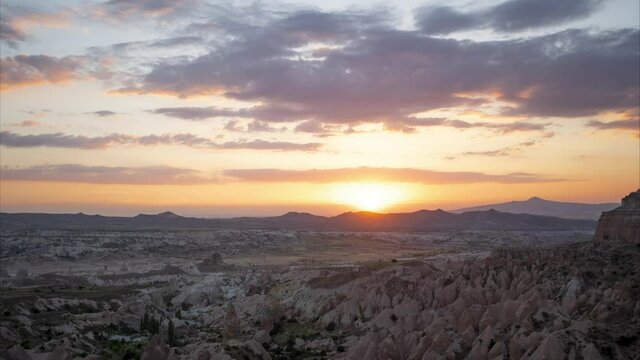 Great amazing sunset aerial view from Aktepe viewpoint high hill. Scenic Red valley in Goreme National Park in Cappadocia region, Central Anatolia, Turkey country. 4k stock video timelapse