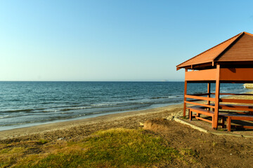beach hut on the beach at sunset