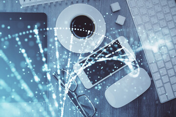 Double exposure of DNA drawing over table with phone. Top view. Science education concept.