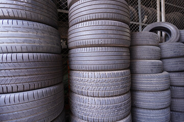 The group of old used car rubber tires stacked