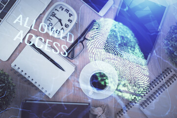 Double exposure of finger print over table with phone. Top view. Concept of mobile security.