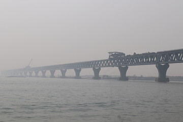 The Padma bridge running construction up the river.