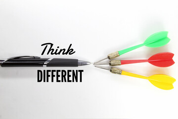 pen and three arrows with the word think Different