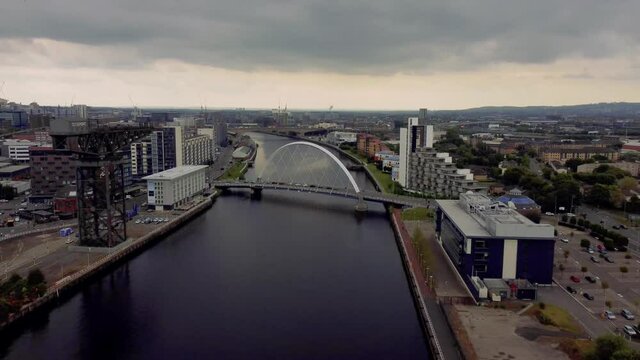 Glasgow Scotland 2021 4k aerial shot of squinty bridge and finnieston crane passing over river clyde