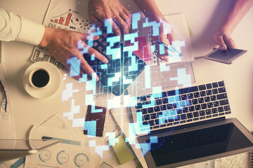 Double exposure of man and woman working together and data theme hologram drawing. Computer background. Top View.