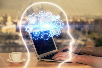 Multi exposure of woman hands working on computer and human brain hologram drawing. Ai tech concept.