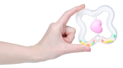 toy rattle in hand on white background isolation