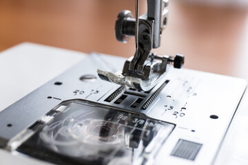 Production line sewing machine. Needle and footstep detail