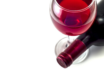 Glass and bottle of red wine on a white background.