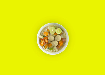 Indonesian Food | Meatball soup served in a white round bowl on a white background