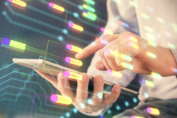 Multi exposure of man's hand holding and using a digital device and data theme drawing. Innovation...