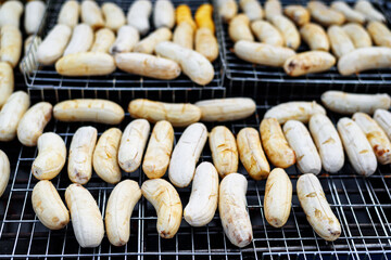 grilled bananas on hot stove in thai street food market