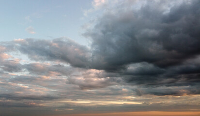 Beautiful contrasting clouds in the sky at sunset. Background for design