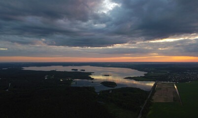 Beautiful contrasting sunset with the landscape of the lake. Background for design