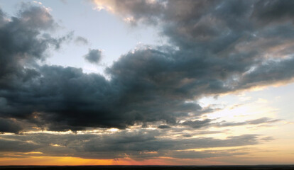 Beautiful contrasting clouds in the sky at sunset. Background for design