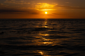 sunset in the middle of the sea